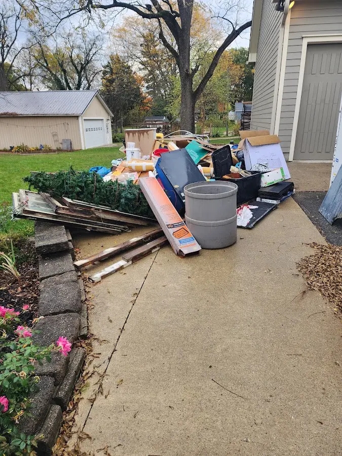Dumpster being loaded with debris for Residential Dumpster Rental in Niles
